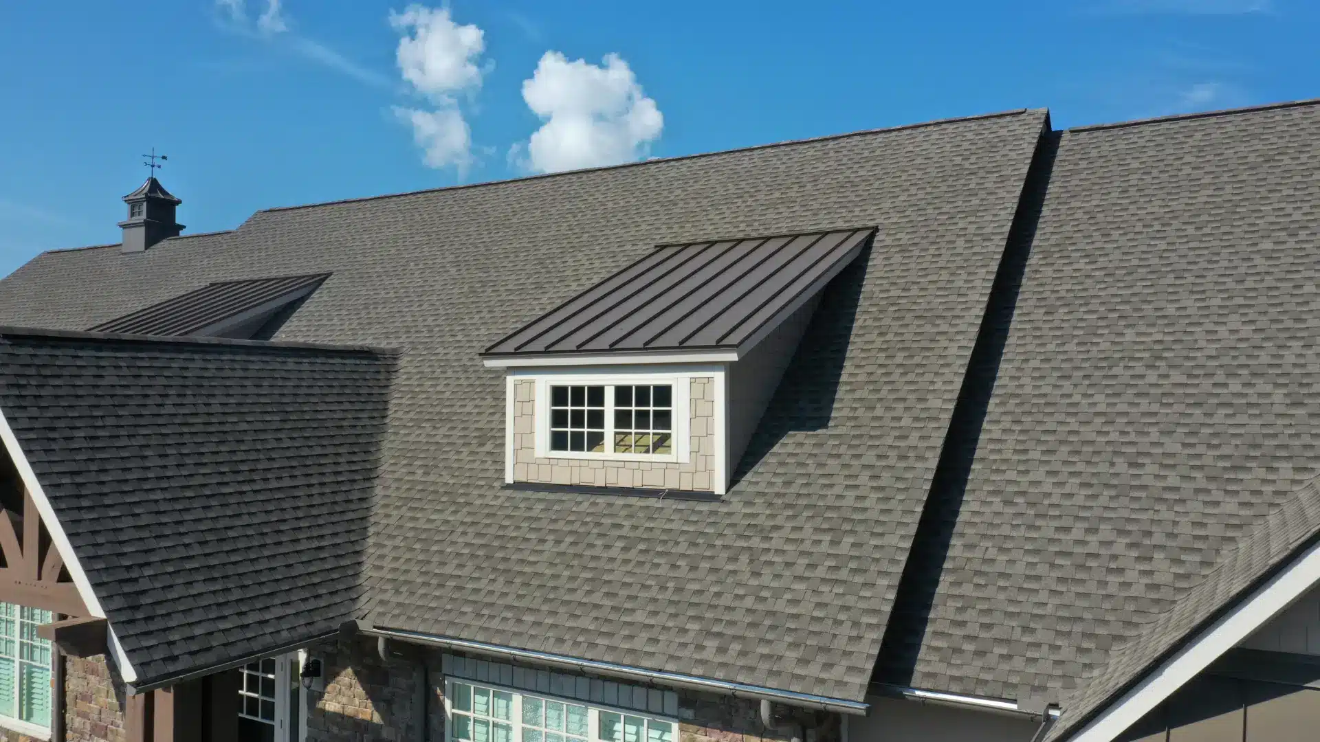 a roof of a house with a dormer window