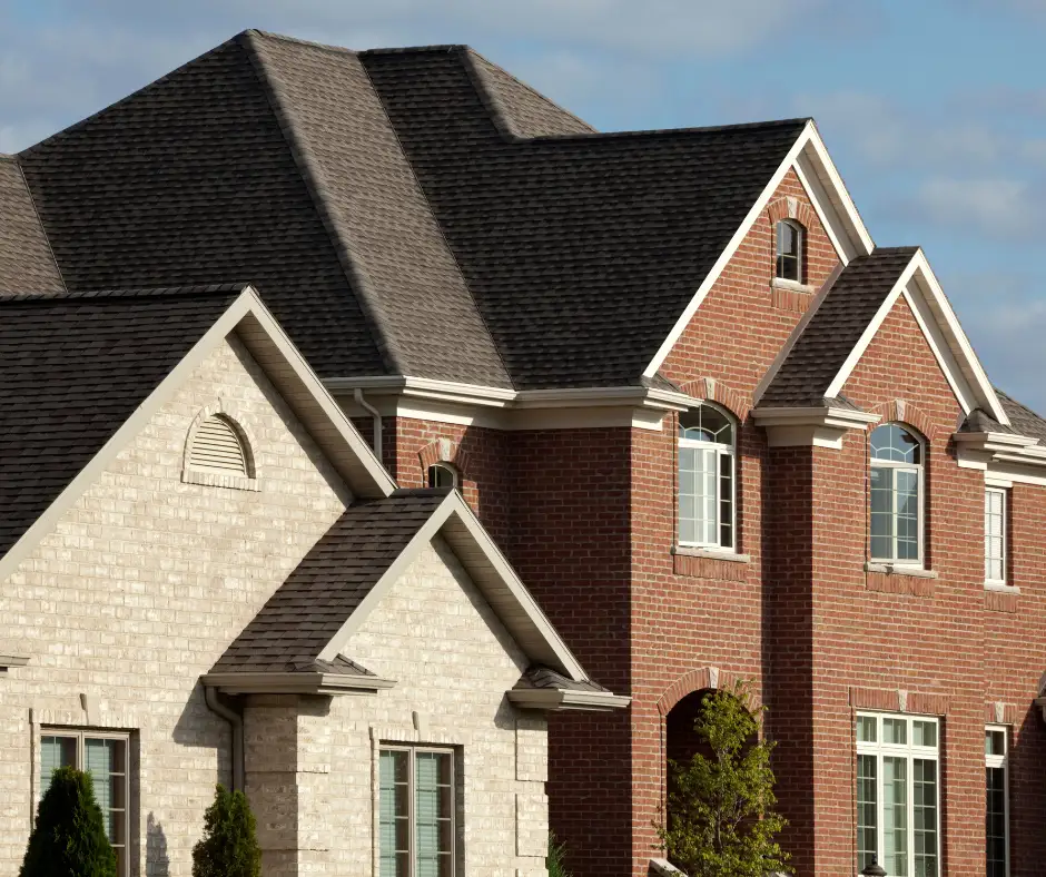 a house with a black roof, example of roofing services in st vital