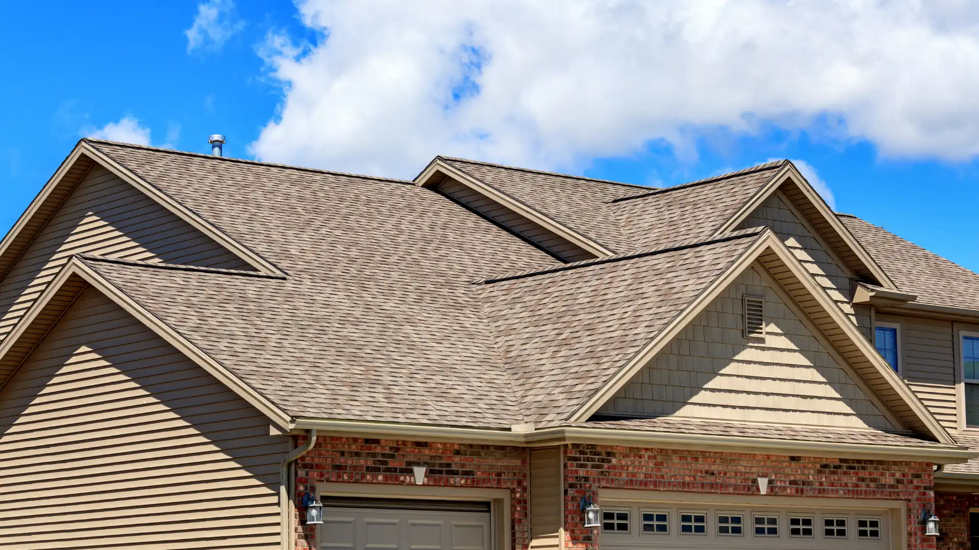 a house with a asphalt shingle roof